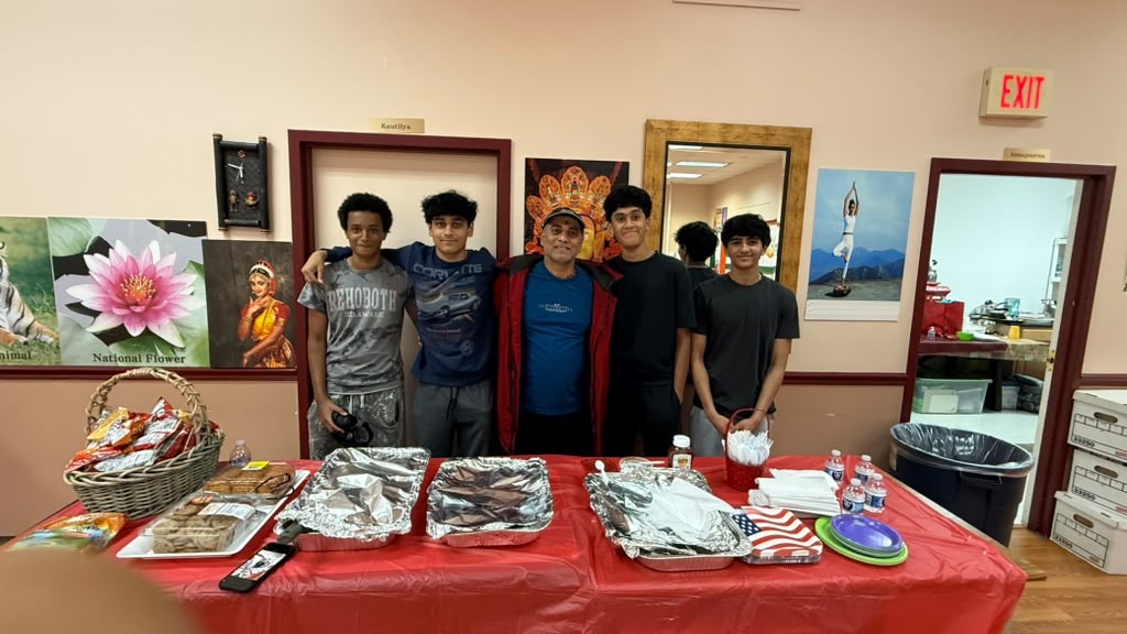 Student volunteers serving food at a community gathering
